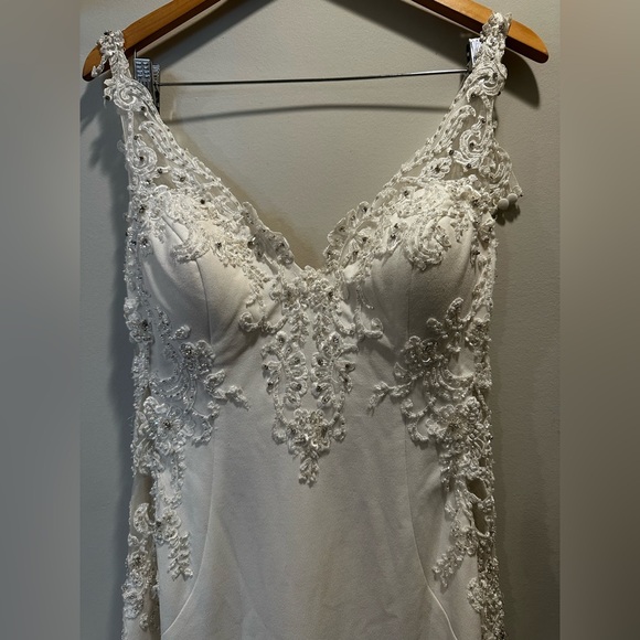 Demetrios Bridal Gown
Color: Ivory Size:10
button covered zipper back - Picture 3 of 6